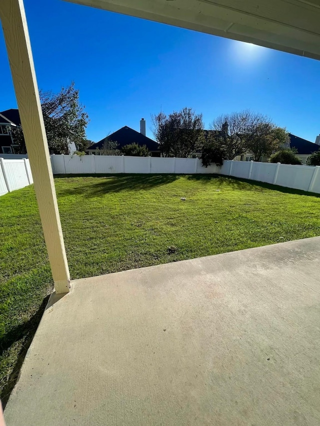 view of yard with a fenced backyard