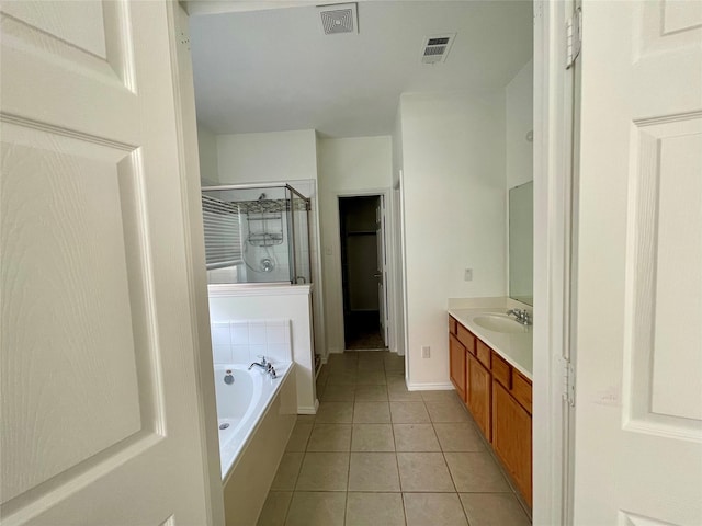 full bath featuring a stall shower, visible vents, a garden tub, and tile patterned floors