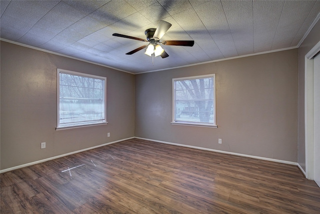 unfurnished room with ceiling fan, baseboards, dark wood-style flooring, and crown molding