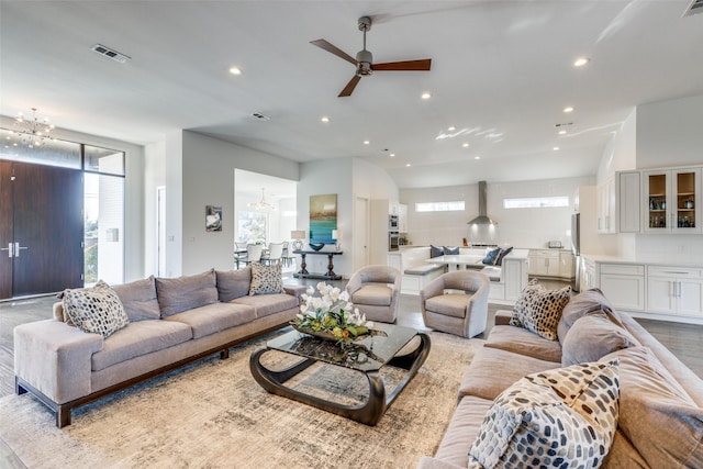 living room featuring visible vents, a wealth of natural light, and recessed lighting