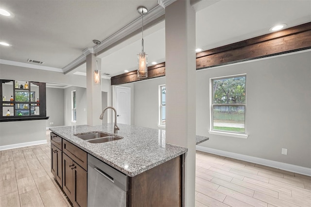 kitchen with light stone counters, wood finish floors, visible vents, stainless steel dishwasher, and a sink