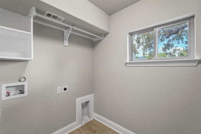 laundry area featuring laundry area, baseboards, visible vents, hookup for a washing machine, and electric dryer hookup