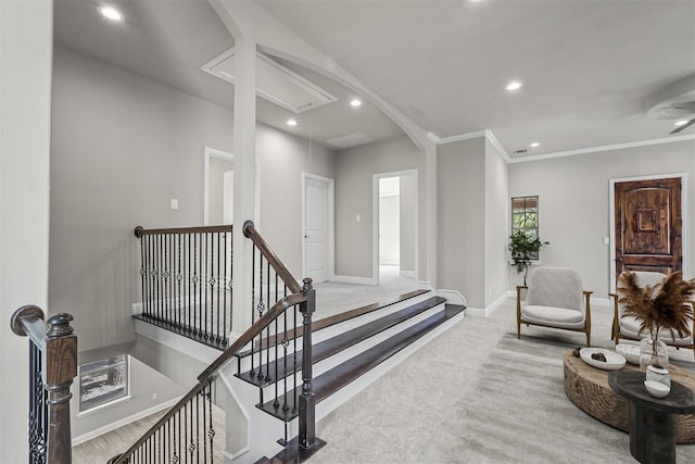 interior space with recessed lighting, light carpet, crown molding, and baseboards