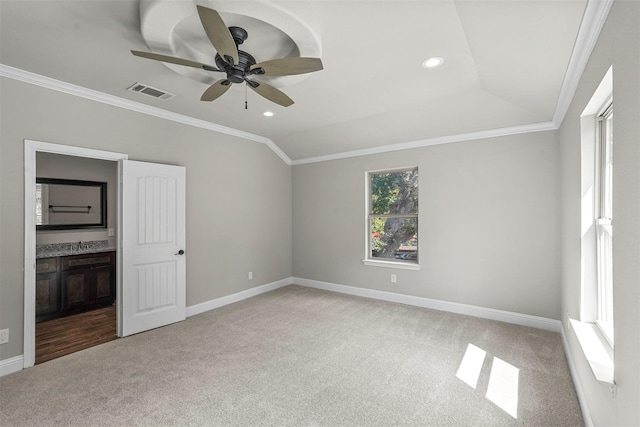 unfurnished bedroom with light carpet, visible vents, ornamental molding, and baseboards