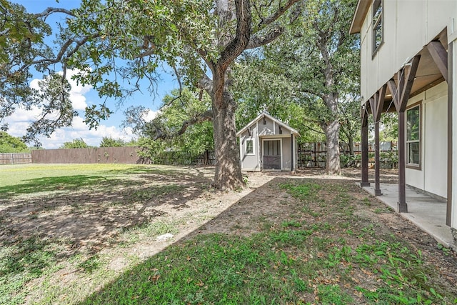 view of yard with an outbuilding and a fenced backyard