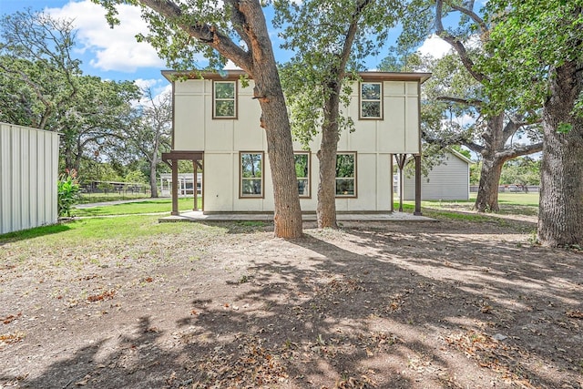 back of property featuring fence