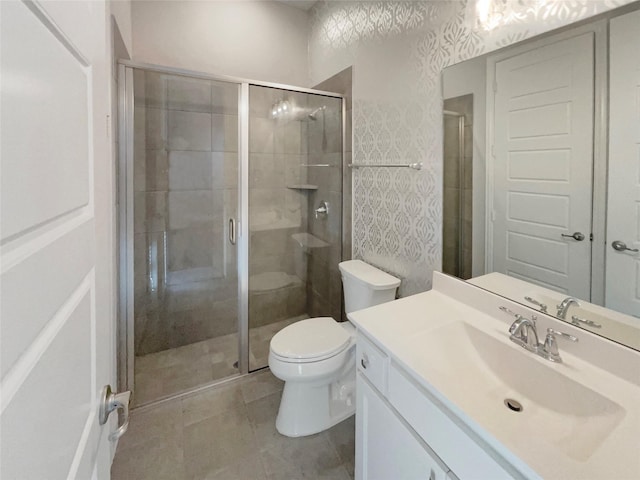 bathroom featuring toilet, a stall shower, wallpapered walls, and vanity