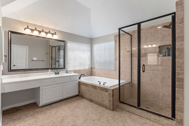 bathroom featuring lofted ceiling, tile patterned flooring, vanity, a shower stall, and a bath