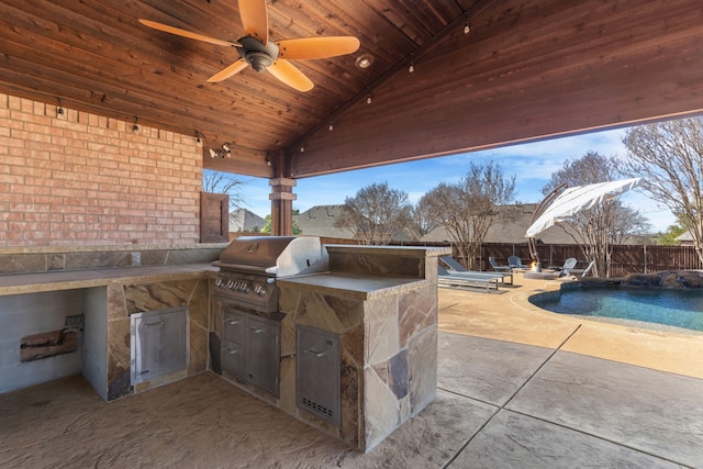 view of patio with a fenced in pool, area for grilling, ceiling fan, exterior kitchen, and a fenced backyard