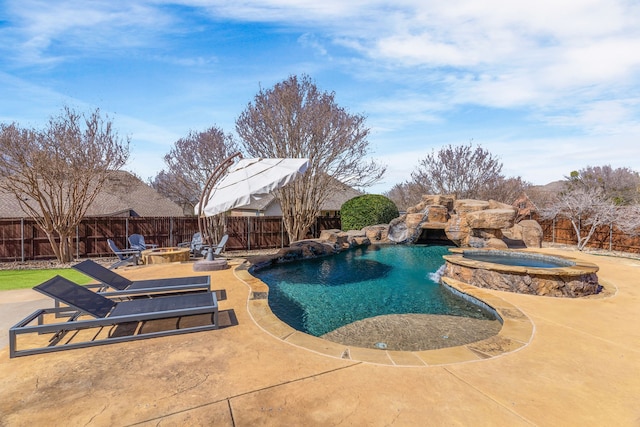 view of pool featuring an outdoor fire pit, a fenced backyard, and an in ground hot tub