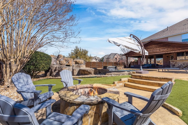 view of patio featuring a fire pit and a gazebo