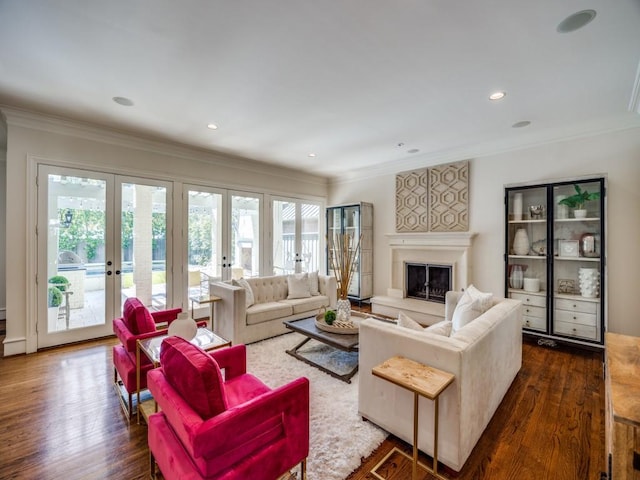 living area with crown molding, french doors, dark wood-type flooring, and a healthy amount of sunlight