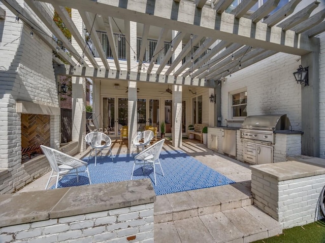 view of patio featuring ceiling fan, a grill, area for grilling, and a pergola