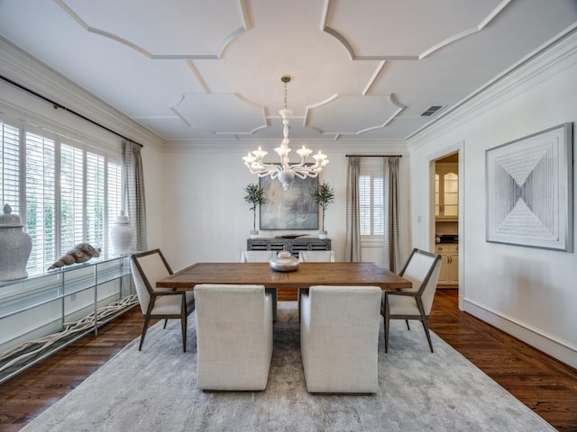 dining area with ornamental molding, wood finished floors, and visible vents