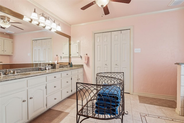 full bathroom featuring a sink, ornamental molding, a closet, and tile patterned floors