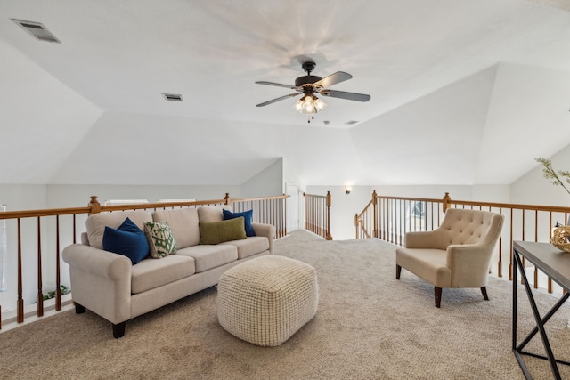 living room featuring lofted ceiling, light carpet, visible vents, and a ceiling fan