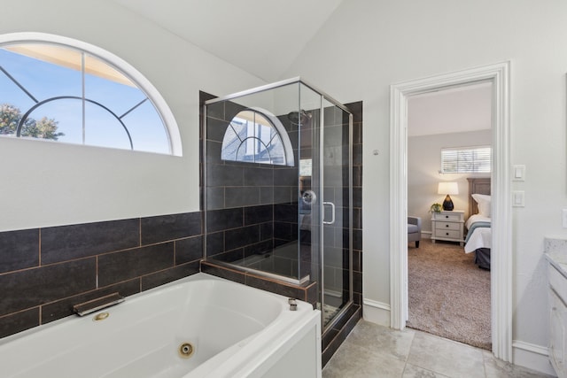 full bath featuring connected bathroom, vanity, a shower stall, tile patterned floors, and a tub with jets