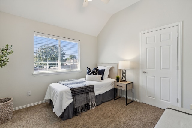 bedroom featuring lofted ceiling, a ceiling fan, baseboards, and carpet flooring