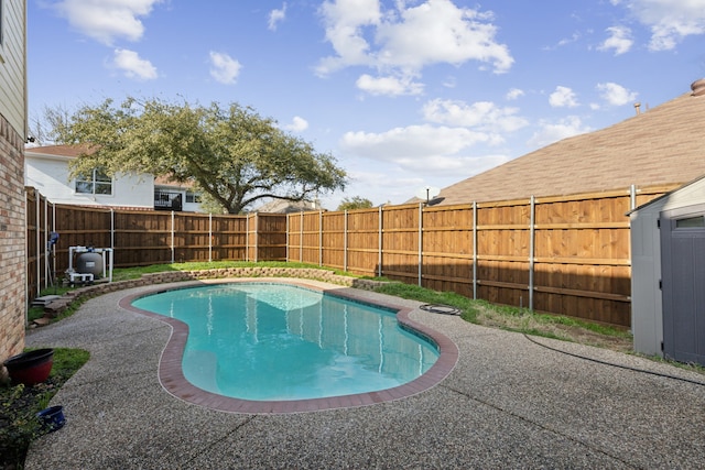 view of swimming pool with a fenced backyard, a fenced in pool, and a patio