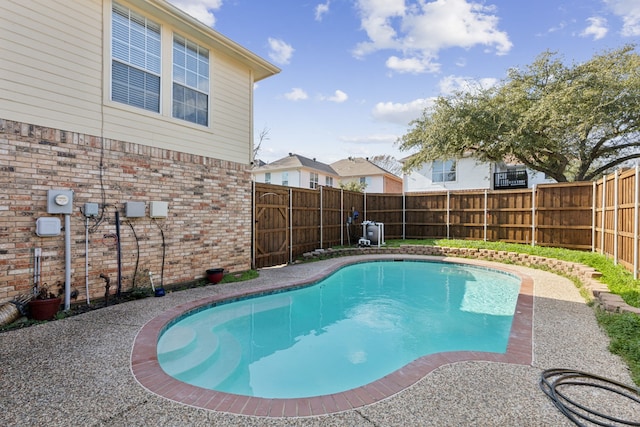 view of swimming pool with a fenced in pool and a fenced backyard