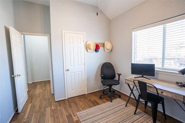 office space with vaulted ceiling and wood finished floors