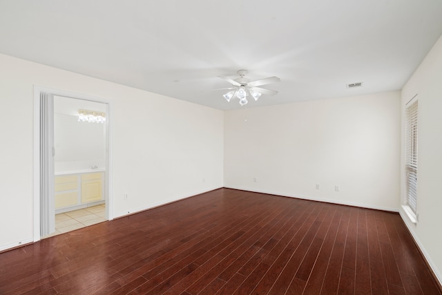 unfurnished room with light wood-style flooring, visible vents, ceiling fan, and baseboards