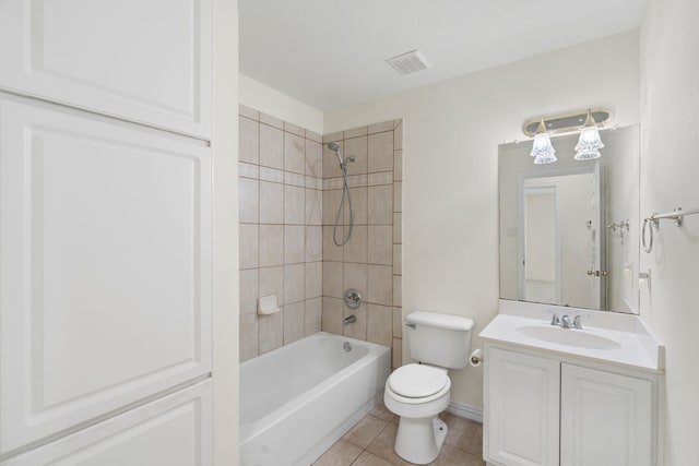 full bathroom with toilet, vanity, visible vents, shower / washtub combination, and tile patterned floors