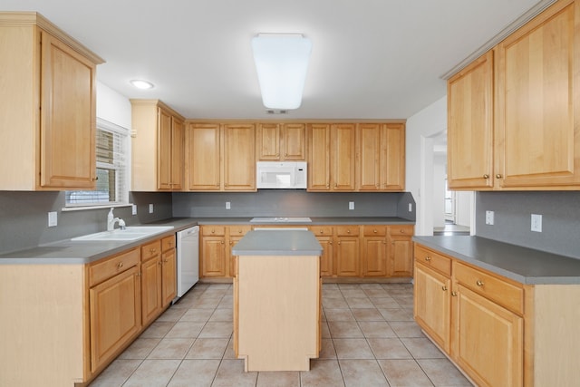 kitchen featuring white appliances, light tile patterned floors, light brown cabinetry, and a center island