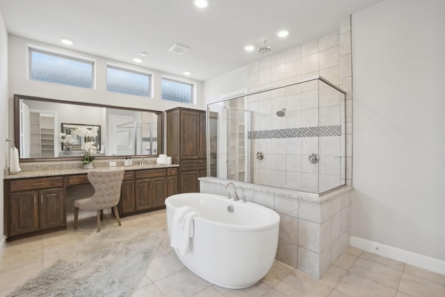 full bathroom featuring a stall shower, vanity, visible vents, and tile patterned floors