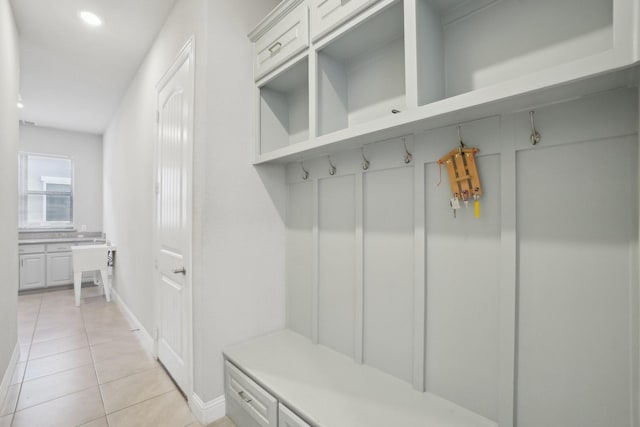 mudroom with light tile patterned flooring