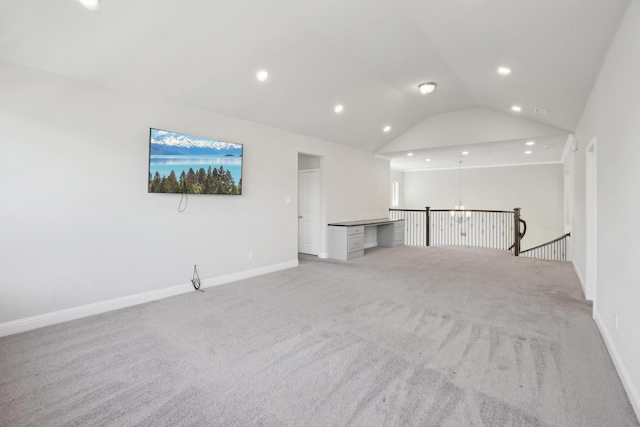 interior space featuring recessed lighting, baseboards, vaulted ceiling, and light colored carpet