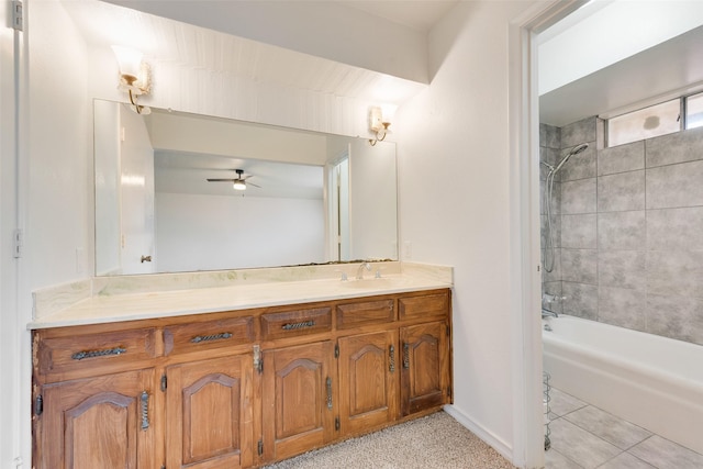 bathroom featuring ceiling fan, vanity, baseboards, and shower / bathtub combination