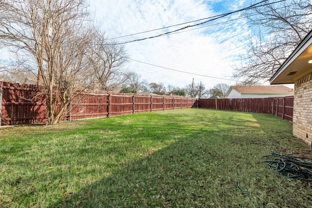 view of yard featuring a fenced backyard