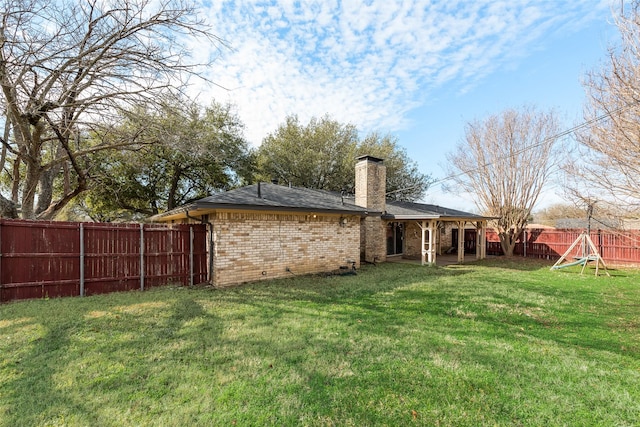 view of yard with a fenced backyard