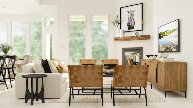 living area with a tiled fireplace