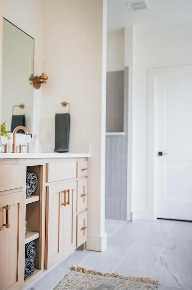 bathroom with vanity and visible vents