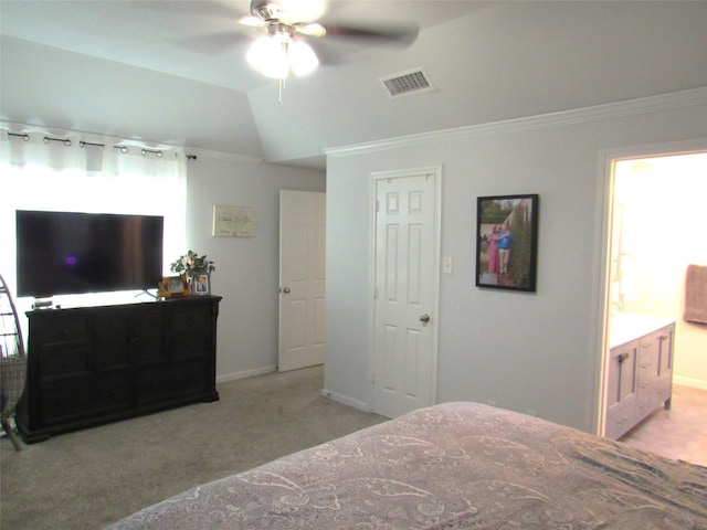 bedroom with vaulted ceiling, light colored carpet, visible vents, and crown molding