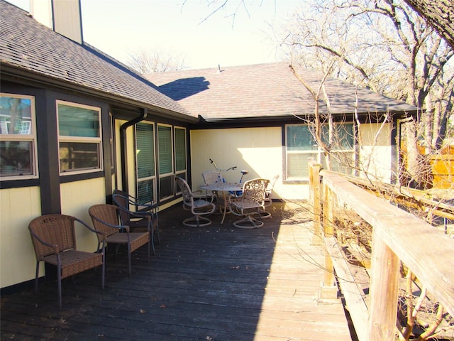 wooden deck with outdoor dining space