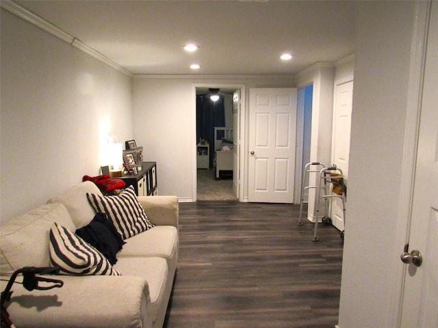 living room with dark wood-style floors, crown molding, and recessed lighting