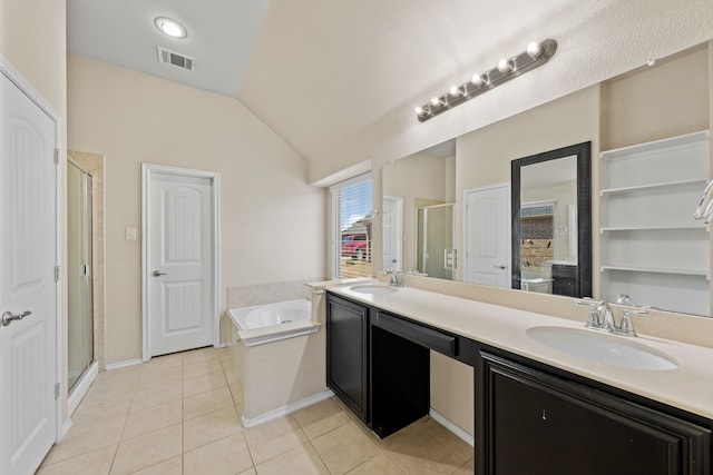 bathroom featuring lofted ceiling, tile patterned flooring, a sink, and visible vents