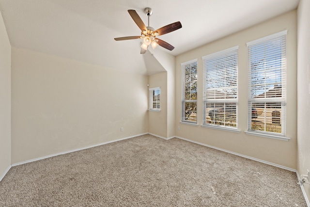 unfurnished room with light carpet, ceiling fan, and baseboards