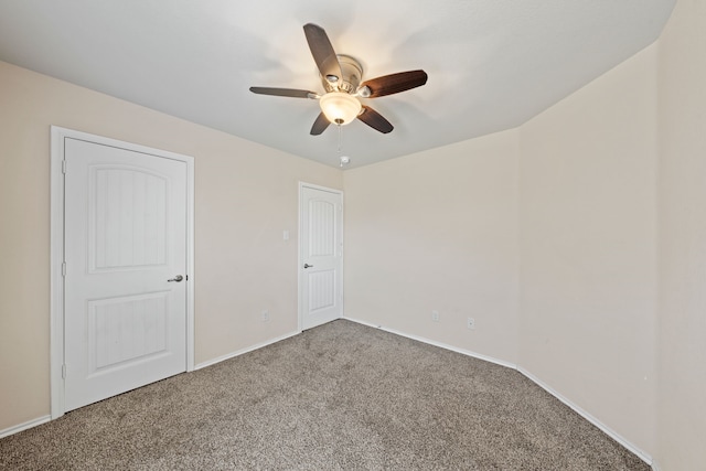 unfurnished bedroom with carpet floors, ceiling fan, and baseboards