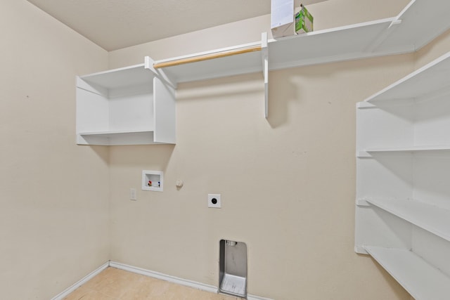 laundry room with laundry area, hookup for a washing machine, electric dryer hookup, and baseboards