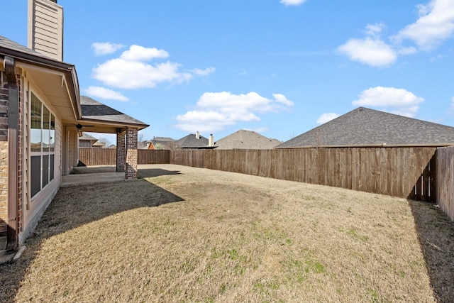 view of yard featuring a fenced backyard