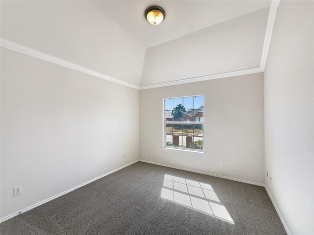 spare room with vaulted ceiling, baseboards, carpet floors, and ornamental molding