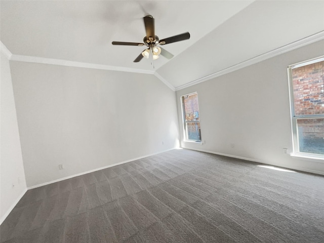 spare room featuring vaulted ceiling, crown molding, baseboards, and dark carpet