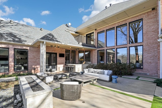 view of patio / terrace with outdoor lounge area and a balcony