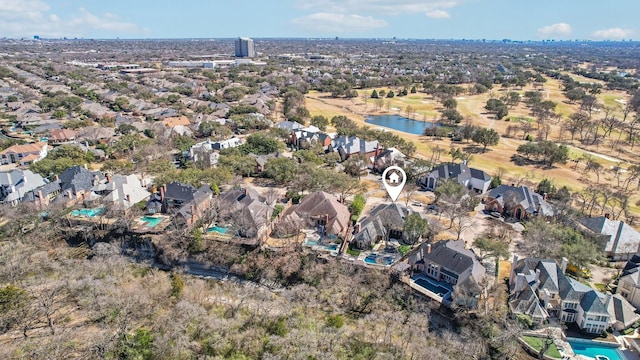 birds eye view of property with a water view and a residential view