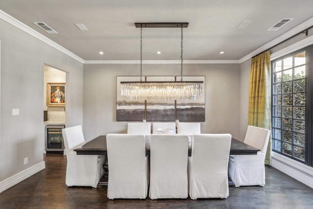 dining area with beverage cooler, ornamental molding, dark wood-type flooring, and visible vents