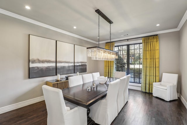 dining area with baseboards, dark wood-style flooring, visible vents, and crown molding